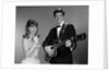 1960s Teenage Entertainment Duo Man Playing Guitar And Woman Singing Holding Microphone by Anonymous