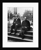 1890s 1900 Two Bearded Men In Suits Holding Bowler Hats Sitting On Stairs In Front Of House by Anonymous