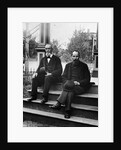 1890s 1900 Two Bearded Men In Suits Holding Bowler Hats Sitting On Stairs In Front Of House by Anonymous