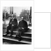 1890s 1900 Two Bearded Men In Suits Holding Bowler Hats Sitting On Stairs In Front Of House by Anonymous