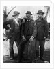 1890s 1900 Three Men With Beard Or Mustache Wearing Hats One Sitting On Barrel by Anonymous