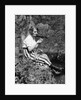 1920s Young Woman In Striped Skirt Sitting On Stream Bank In Woods Braiding Garland Of Wild Flowers by Anonymous