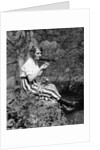1920s Young Woman In Striped Skirt Sitting On Stream Bank In Woods Braiding Garland Of Wild Flowers by Anonymous