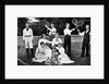1890s 1900 Men Holding Racquets and Women and One Child In Front Of Net On Grass Tennis Court by Anonymous