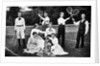 1890s 1900 Men Holding Racquets and Women and One Child In Front Of Net On Grass Tennis Court by Anonymous