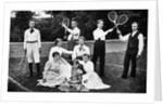 1890s 1900 Men Holding Racquets and Women and One Child In Front Of Net On Grass Tennis Court by Anonymous