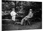 1900 Two Men Sitting Outside In Chairs Among Trees Smoking Cigars Talking Dog Laying At Their Feet by Anonymous