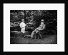 1900 Two Men Sitting Outside In Chairs Among Trees Smoking Cigars Talking Dog Laying At Their Feet by Anonymous