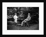 1900 Two Men Sitting Outside In Chairs Among Trees Smoking Cigars Talking Dog Laying At Their Feet by Anonymous