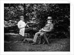 1900 Two Men Sitting Outside In Chairs Among Trees Smoking Cigars Talking Dog Laying At Their Feet by Anonymous