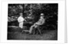 1900 Two Men Sitting Outside In Chairs Among Trees Smoking Cigars Talking Dog Laying At Their Feet by Anonymous