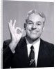 1950s Portrait Of Happy Man Businessman Slesman Making An Ok Hand Sign by Anonymous