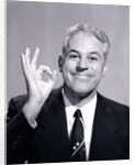 1950s Portrait Of Happy Man Businessman Slesman Making An Ok Hand Sign by Anonymous