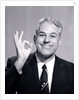 1950s Portrait Of Happy Man Businessman Slesman Making An Ok Hand Sign by Anonymous