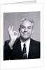 1950s Portrait Of Happy Man Businessman Slesman Making An Ok Hand Sign by Anonymous