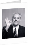 1950s Portrait Of Happy Man Businessman Slesman Making An Ok Hand Sign by Anonymous