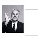 1950s Portrait Of Happy Man Businessman Slesman Making An Ok Hand Sign by Anonymous