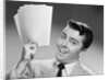 1950s Young Businessman Holding Up Handful Of Papers by Anonymous