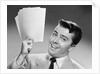 1950s Young Businessman Holding Up Handful Of Papers by Anonymous