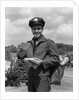 1950s Man Postman Holding Out Letter by Anonymous