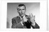 1950s Earnest Salesman Talking Gesturing With Hands by Anonymous