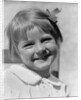 1930s Young Girl Outdoor Portrait With Freckles And Bow In Hair At Camera by Anonymous
