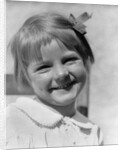 1930s Young Girl Outdoor Portrait With Freckles And Bow In Hair At Camera by Anonymous