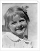 1930s Young Girl Outdoor Portrait With Freckles And Bow In Hair At Camera by Anonymous