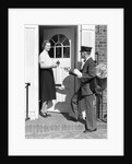 1930s Postman Giving A Letter To A Woman In The Doorway Of A Colonial Brick Home by Anonymous