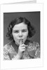 1930s Portrait Of Young Girl With Finger To Mouth Making Shush Be Quiet Expression by Anonymous