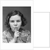 1930s Portrait Of Young Girl With Finger To Mouth Making Shush Be Quiet Expression by Anonymous