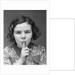 1930s Portrait Of Young Girl With Finger To Mouth Making Shush Be Quiet Expression by Anonymous
