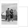 1940s Teenage Couple Walking On Suburban Sidewalk by Anonymous
