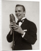 1920s 1930s Man Radio Singer Entertainer Crooner In Tuxedo Singing Into Microphone by Anonymous