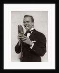 1920s 1930s Man Radio Singer Entertainer Crooner In Tuxedo Singing Into Microphone by Anonymous