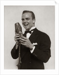 1920s 1930s Man Radio Singer Entertainer Crooner In Tuxedo Singing Into Microphone by Anonymous