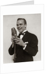 1920s 1930s Man Radio Singer Entertainer Crooner In Tuxedo Singing Into Microphone by Anonymous