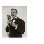 1920s 1930s Man Radio Singer Entertainer Crooner In Tuxedo Singing Into Microphone by Anonymous