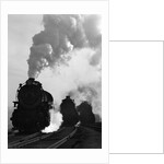 1930s 1940s Head-On View Of Three Steam Engines Silhouetted Against Billowing Smoke And Steam Outdoor by Anonymous