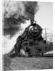 1920s 1930s Steam Engine Pulling Passenger Train Smoke Billowing From Exhaust Stack by Anonymous