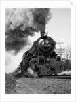 1920s 1930s Steam Engine Pulling Passenger Train Smoke Billowing From Exhaust Stack by Anonymous