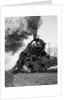 1920s 1930s Steam Engine Pulling Passenger Train Smoke Billowing From Exhaust Stack by Anonymous