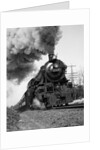 1920s 1930s Steam Engine Pulling Passenger Train Smoke Billowing From Exhaust Stack by Anonymous