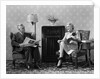 1940s Senior Couple Sitting In Living Room Reading Newspaper And Magazine Listening To Radio by Anonymous