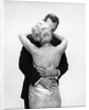 1950s 1960s Wife In Backless Satin Gown Evening Dress And Husband Embracing And Kissing by Anonymous