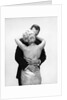 1950s 1960s Wife In Backless Satin Gown Evening Dress And Husband Embracing And Kissing by Anonymous