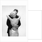 1950s 1960s Wife In Backless Satin Gown Evening Dress And Husband Embracing And Kissing by Anonymous