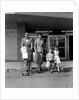 1950s Family Walking Out Of Supermarket Store by Anonymous