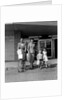 1950s Family Walking Out Of Supermarket Store by Anonymous