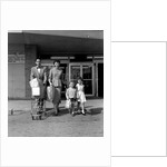 1950s Family Walking Out Of Supermarket Store by Anonymous